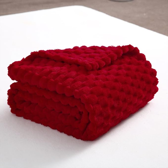 Red fleece throw blanket for cozy Christmas gift basket